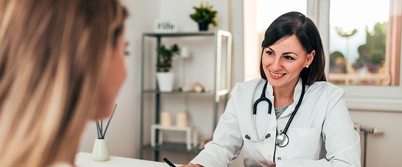 A doctor smiles