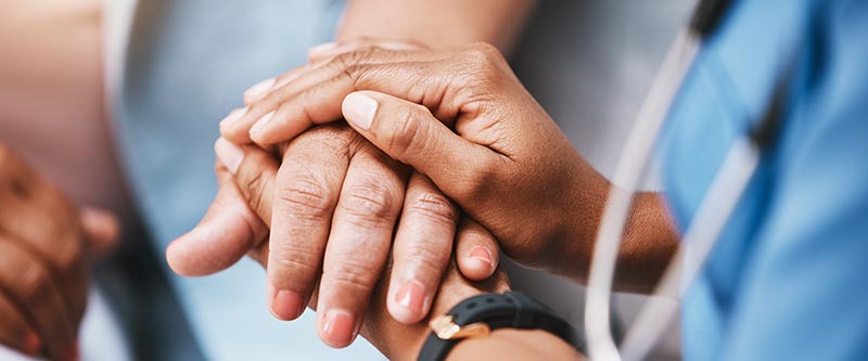A patient gets support from a doctor